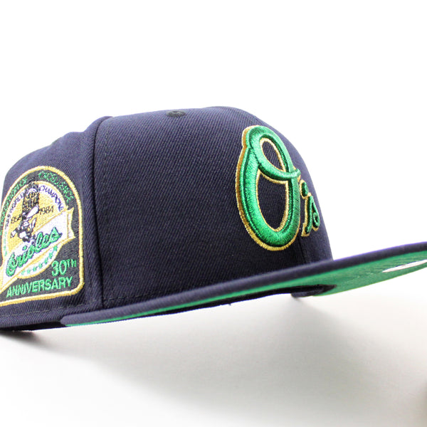 BaltimoreOriolesAtraditionOfExcellence30thAnniversary59FiftyNewEraFittedHat_NavyGreenUnderBrim_-1_600x600.jpg