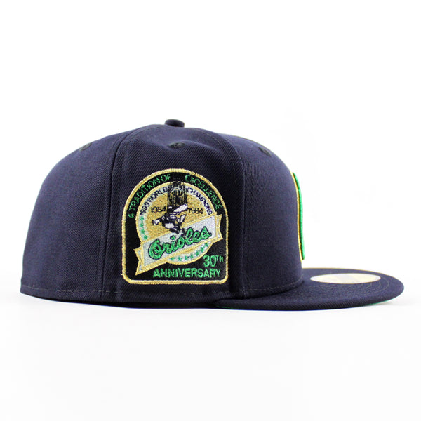 BaltimoreOriolesAtraditionOfExcellence30thAnniversary59FiftyNewEraFittedHat_NavyGreenUnderBrim_-2_600x600.jpg