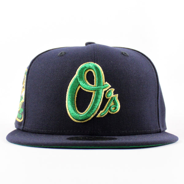 BaltimoreOriolesAtraditionOfExcellence30thAnniversary59FiftyNewEraFittedHat_NavyGreenUnderBrim_-3_600x600.jpg