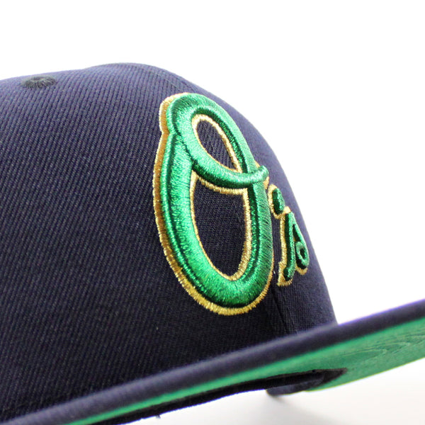 BaltimoreOriolesAtraditionOfExcellence30thAnniversary59FiftyNewEraFittedHat_NavyGreenUnderBrim_-5_600x600.jpg