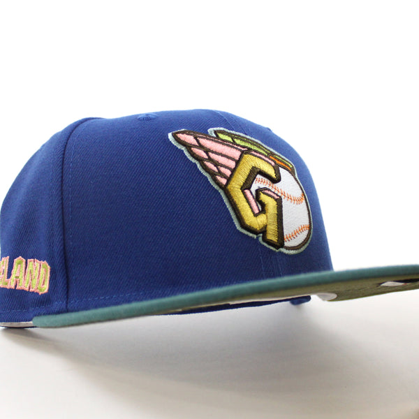 Cleveland-Guardians-CLEVELAND-New-Era-59Fifty-Fitted-Hat-_SONGBIRD-BLUE-PINE-NEEDLE-GREEN-NEW-OLIVE-Under-Brim_-1_600x600.jpg