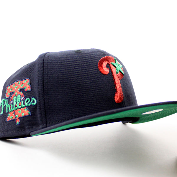 PhiladelphiaPhilliesLibertyBellPatch59FiftyNewEraFittedHat_NavyandGreenUnderBrim_-1_600x600.jpg