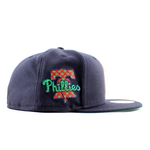 PhiladelphiaPhilliesLibertyBellPatch59FiftyNewEraFittedHat_NavyandGreenUnderBrim_-2_600x600.jpg